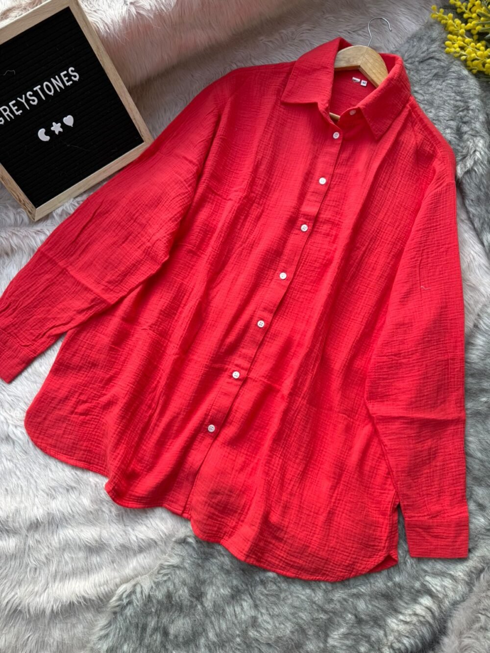 Vibrant coral red cotton shirt in a relaxed, breathable design with folded collar