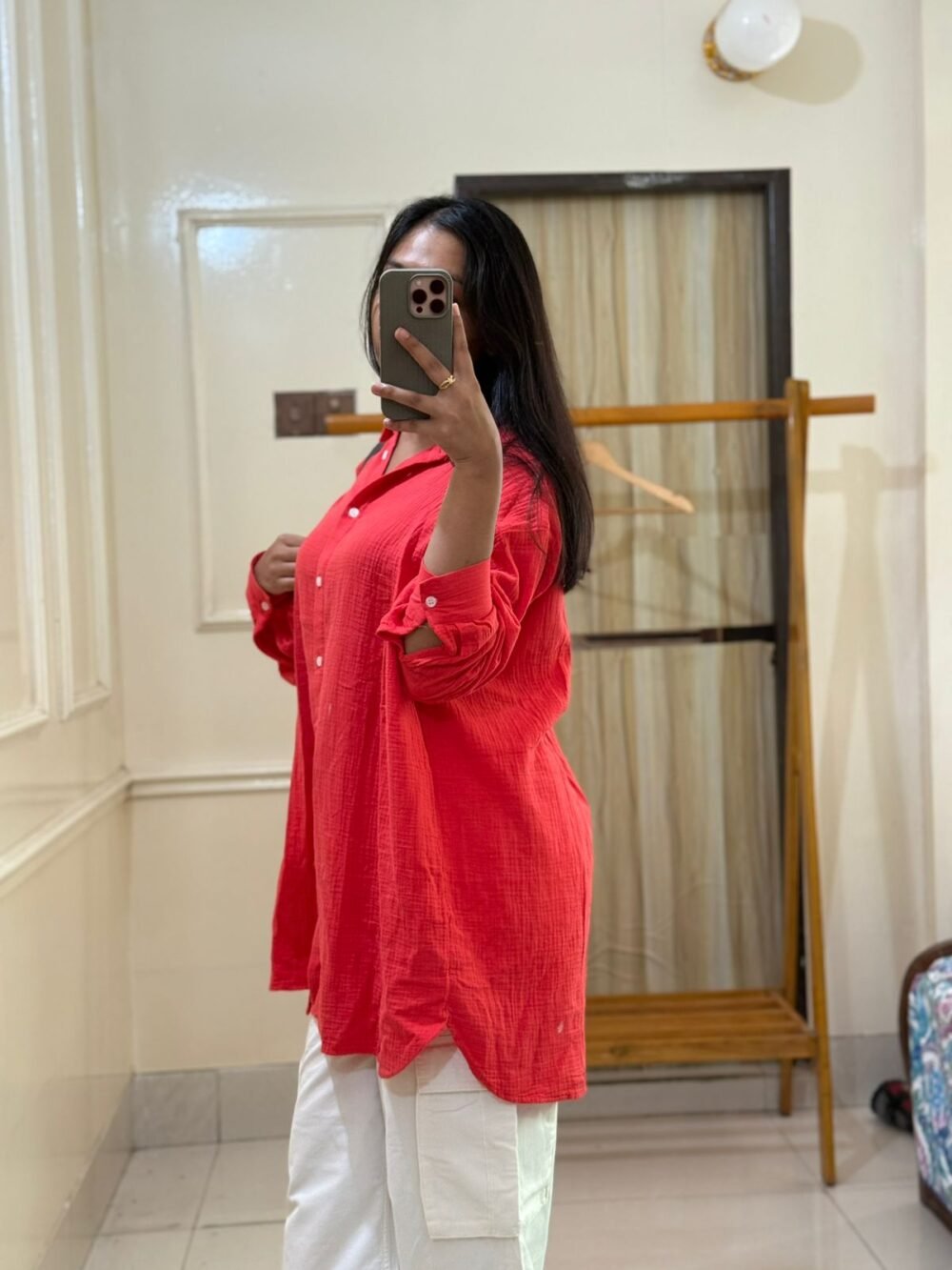 Vibrant coral red cotton shirt in a relaxed, breathable design with folded collar"