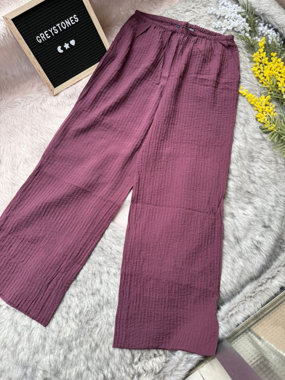Deep maroon crinkled cotton pants with a soft texture and loose fit, ideal for relaxed or on-the-go styling.