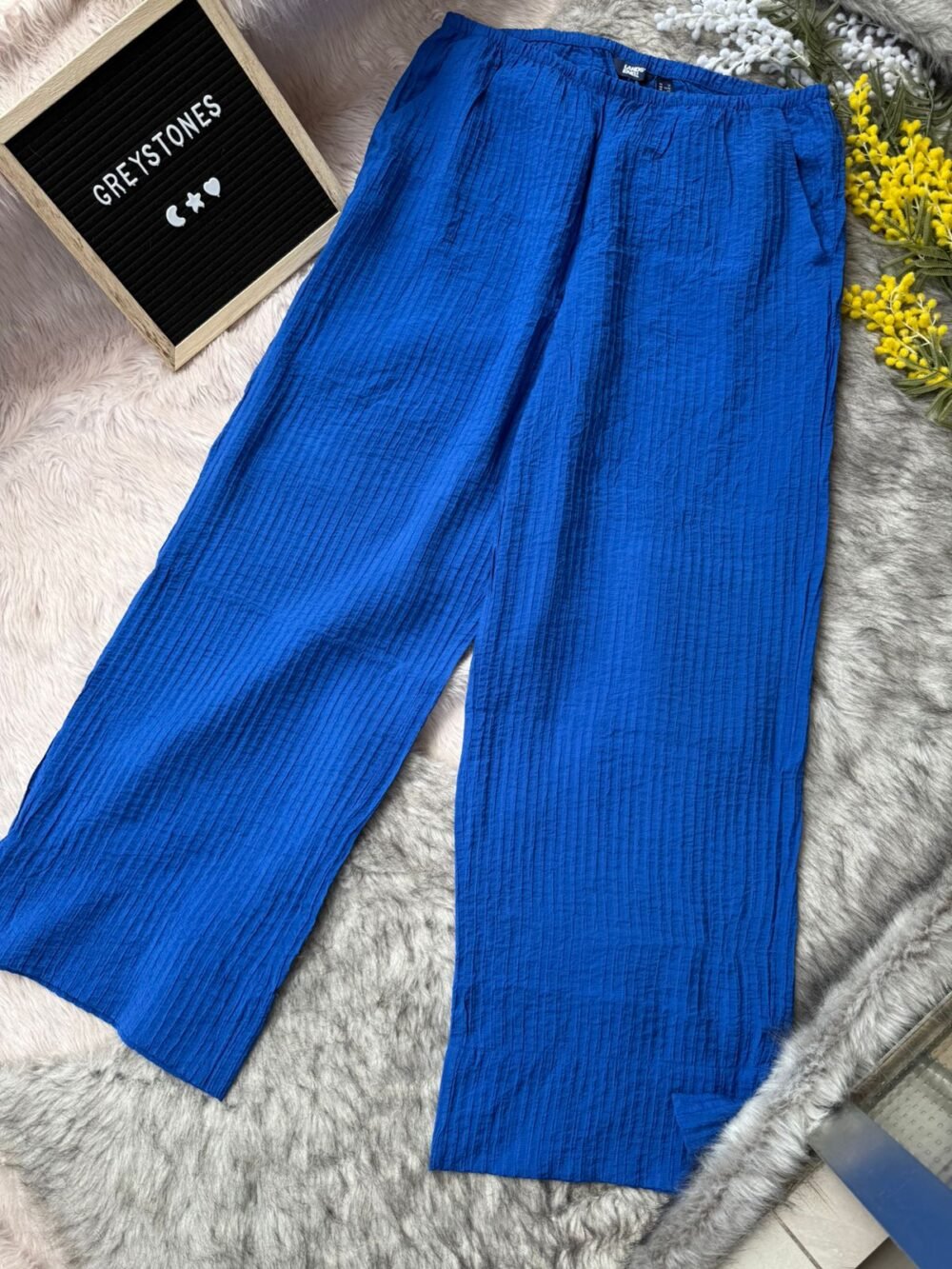 Vibrant royal blue crinkled cotton pants featuring a relaxed wide-leg design and comfy elastic waist, perfect for summer wear.