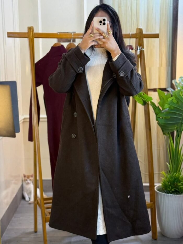 A long brown women’s wool-blend trench coat with double-breasted buttons