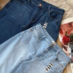 Two pairs of women’s baggy denim jeans in light and dark blue