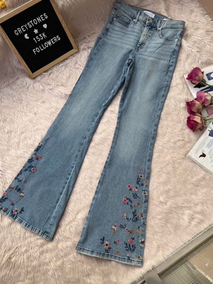 Women’s light blue embroidered flare denim jeans with floral embroidery detail