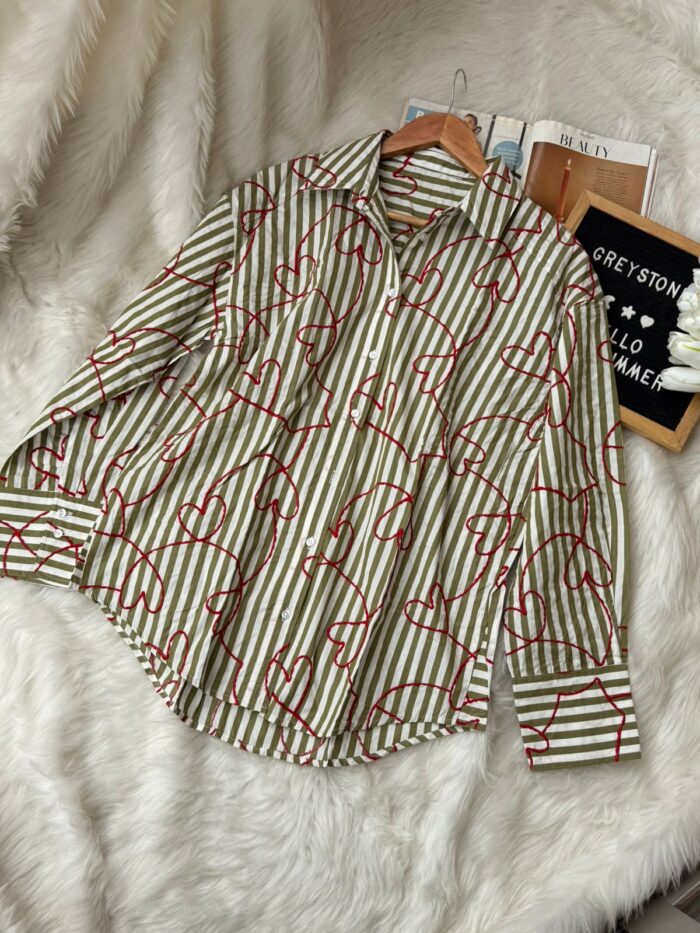 Women’s button-down striped shirt with abstract red heart pattern
