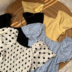 Women’s trendy smocked puff sleeve tops collection flatlay