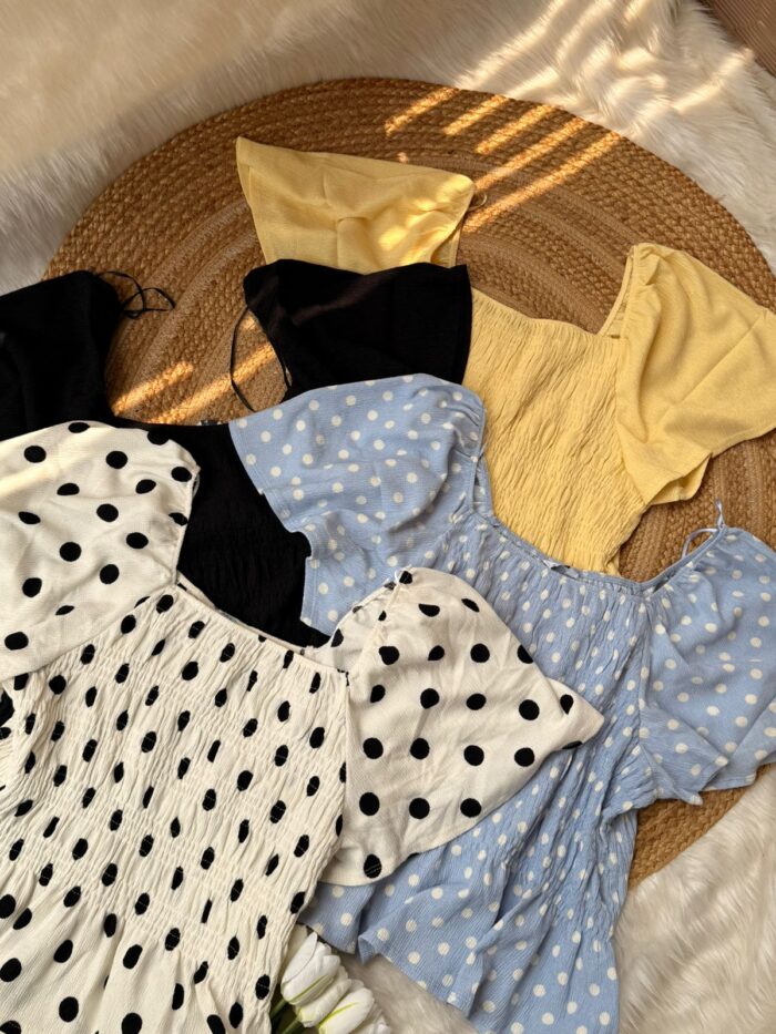 Women’s trendy smocked puff sleeve tops collection flatlay